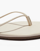 close up of a cream sandal
