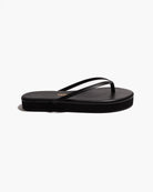black flip flop with a platform