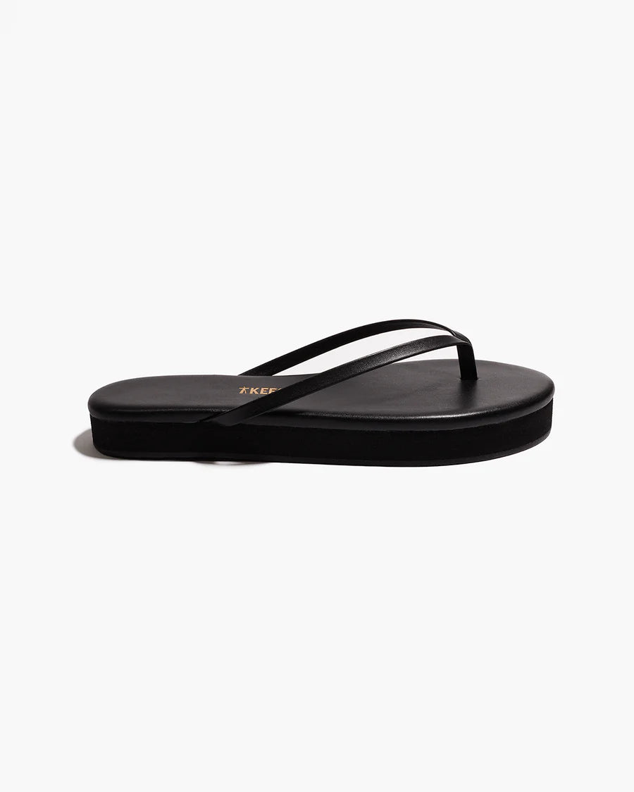 black flip flop with a platform