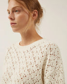 white crochet sweater