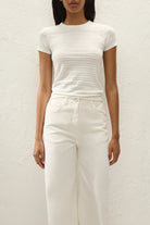 white short sleeve top with a pointelle print