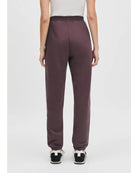 burgundy sweatpants with the text favorite daughter on the side of the leg