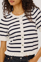 short sleeve sweater with white and navy stripes and a ruffle on the bottom of skirt and sleeves
