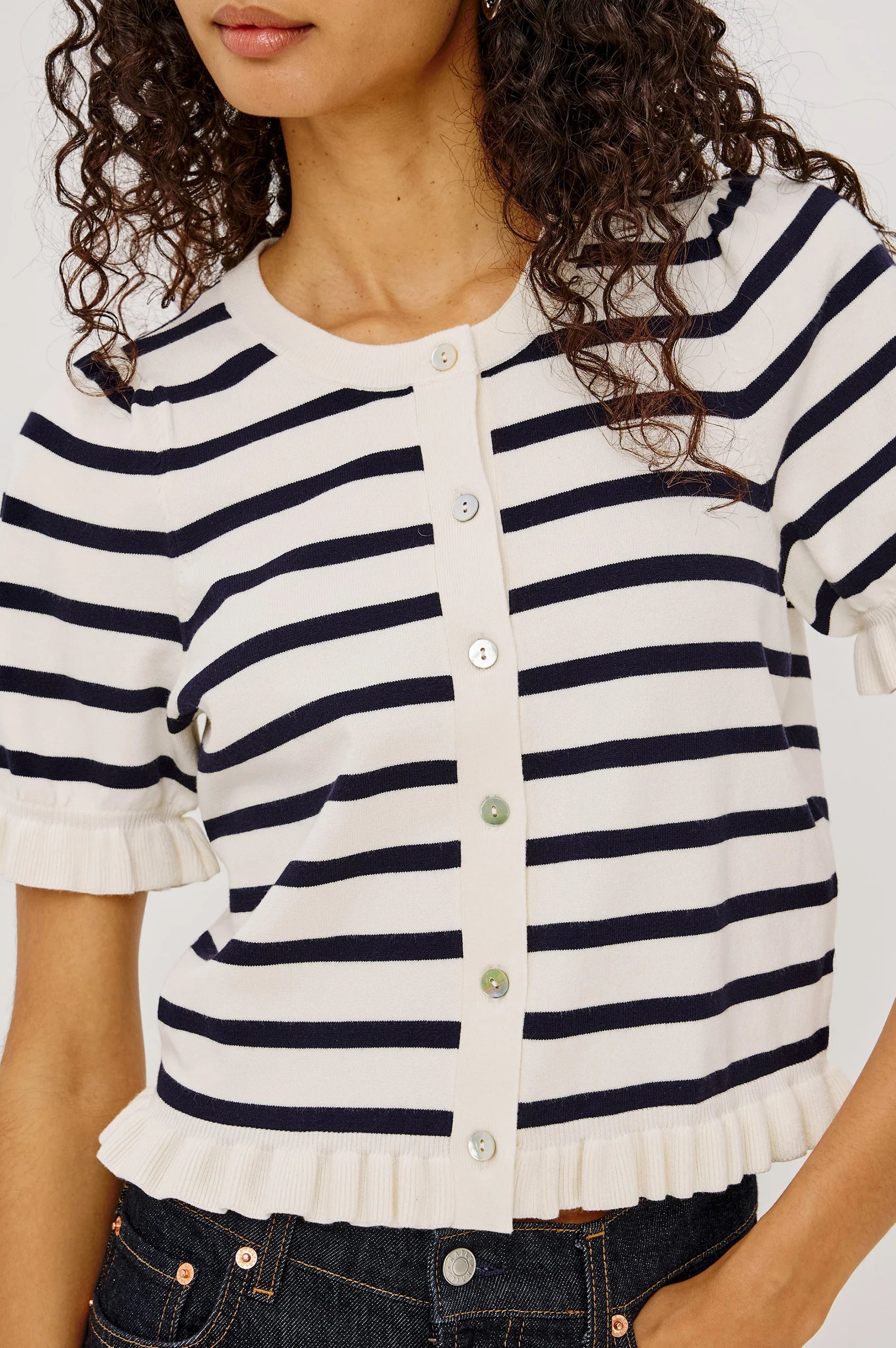 short sleeve sweater with white and navy stripes and a ruffle on the bottom of skirt and sleeves