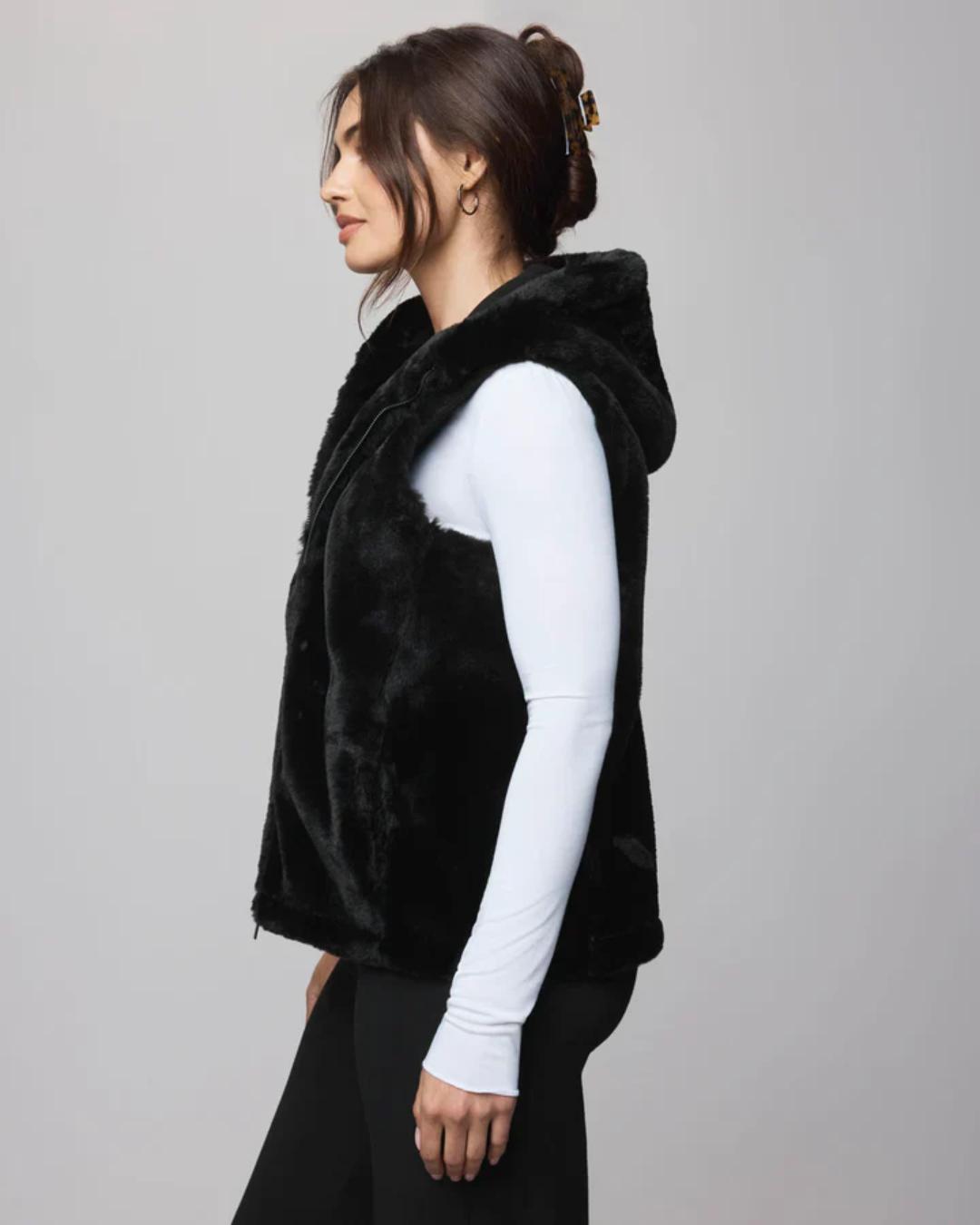 fur vest in black with a hood