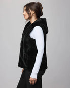 fur vest in black with a hood