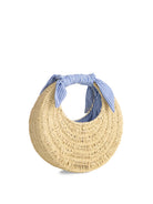 hand bag made out of straw with blue striped ties on the handle