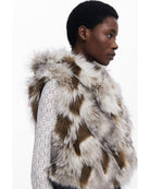 fur vest with denim on the bottom