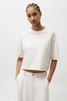 off white crop top with slit in the back