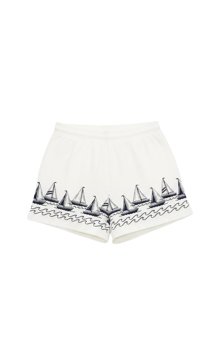 white lounge shorts with navy sailboats on the bottom 