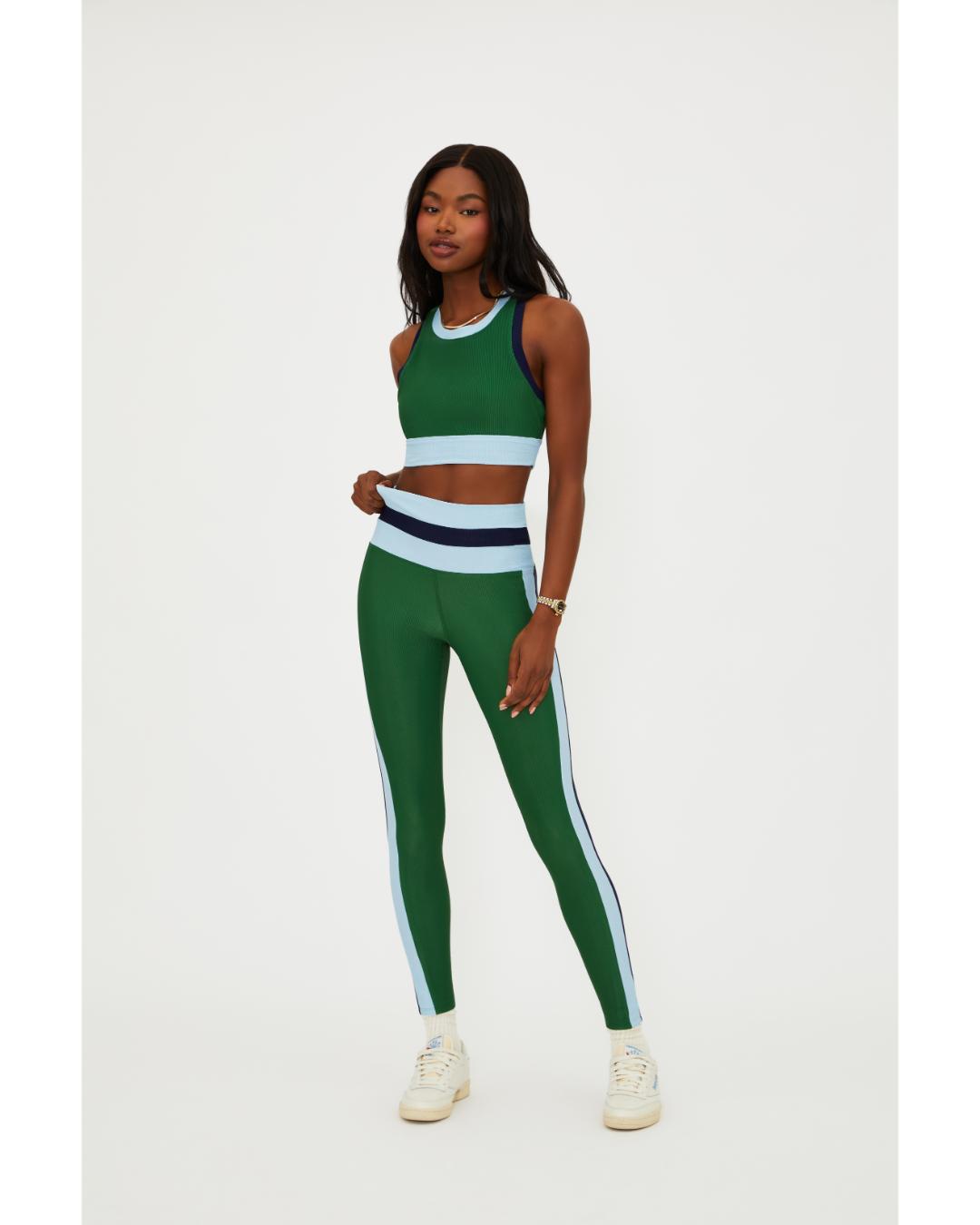 green leggings with a blue and navy stripe down the side