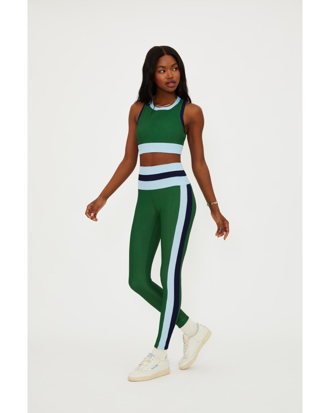 green leggings with a blue and navy stripe down the side