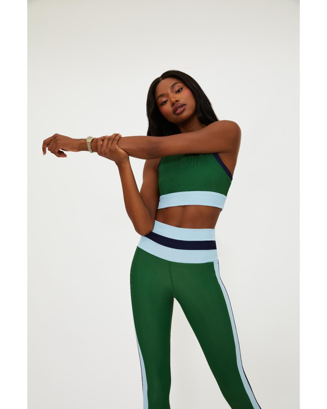 green leggings with a blue and navy stripe down the side