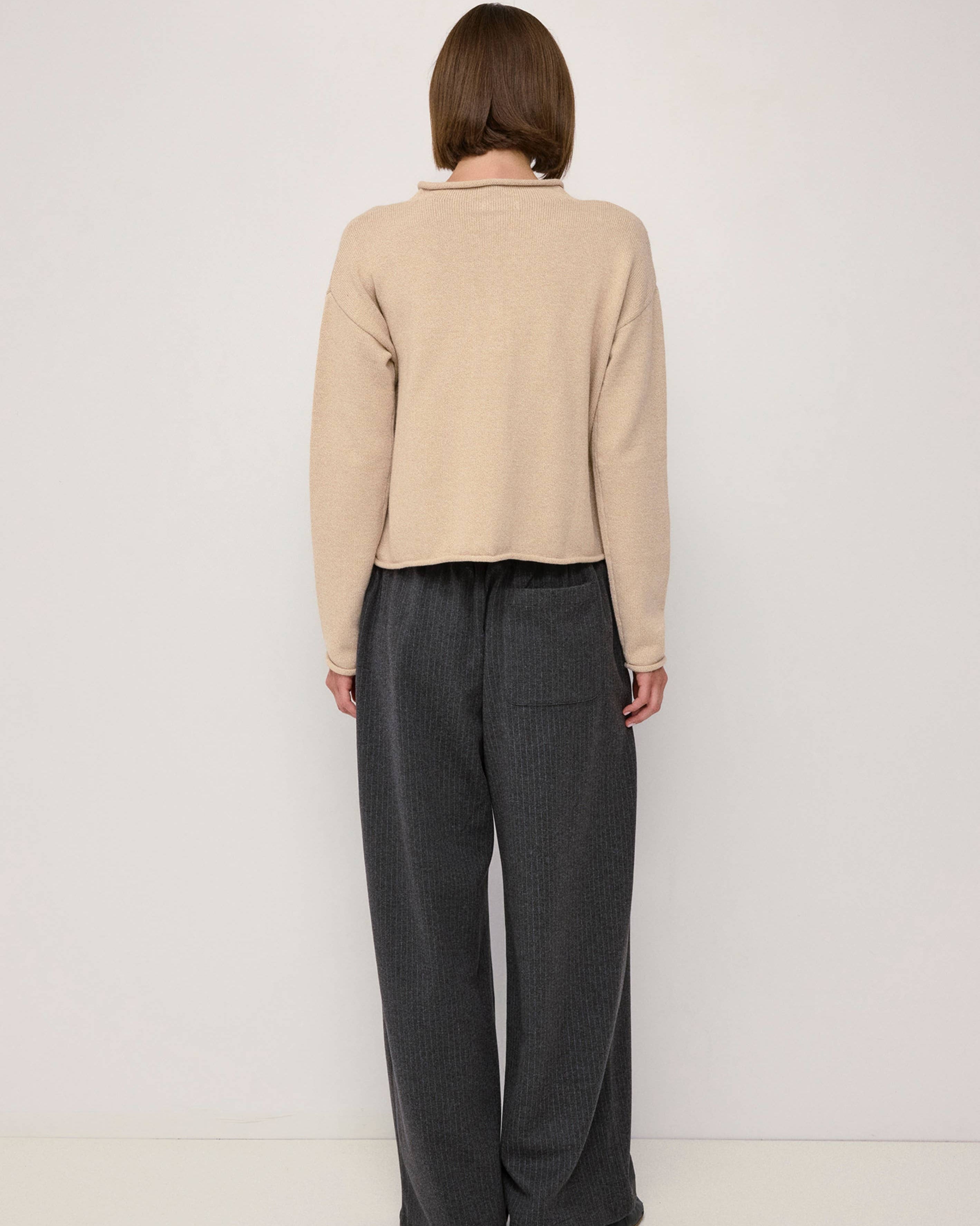 beige cardigan with a rolled hem