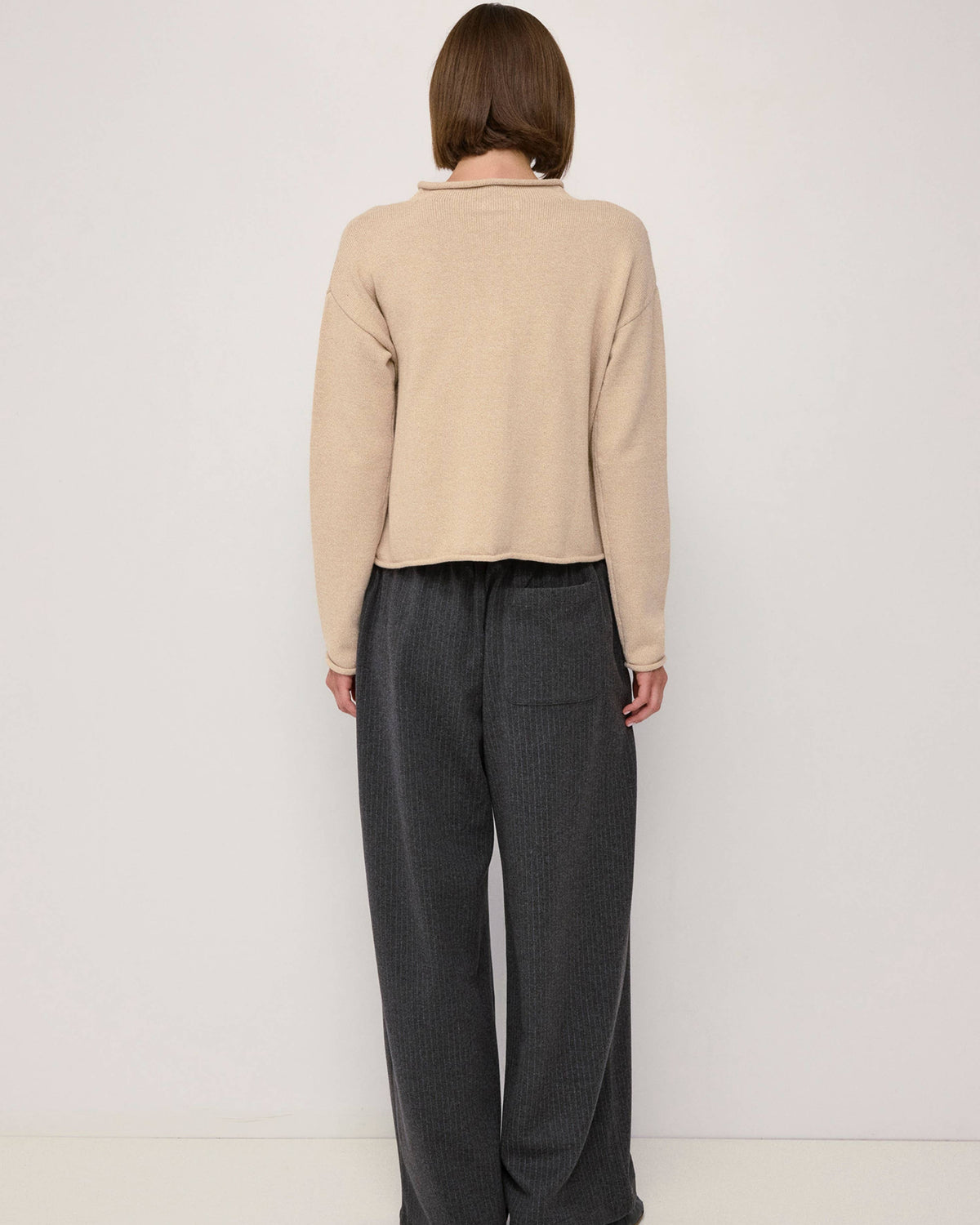 beige cardigan with a rolled hem