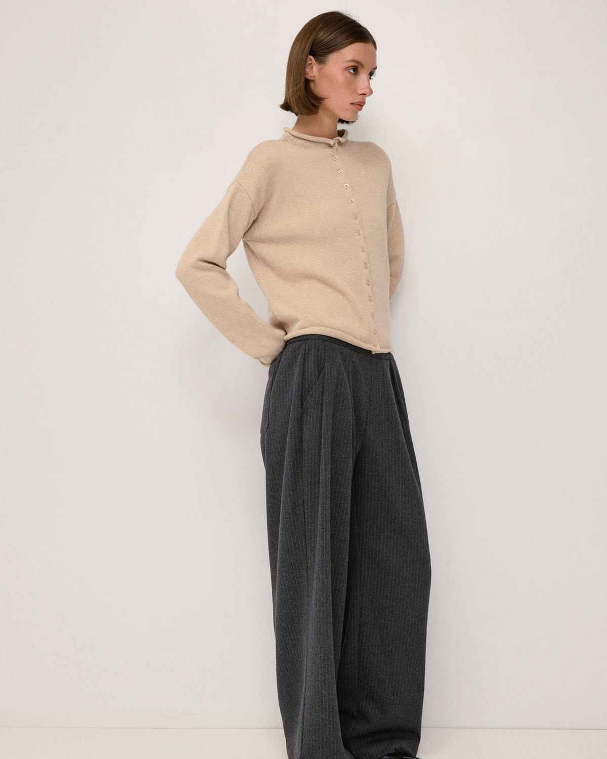 beige cardigan with a rolled hem