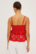 red tank top with eyelet detail