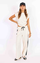 wide leg lounge pant in beige with black stripe down the side