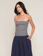 strapless midi dress with navy stripes on top and a drop waist bottom
