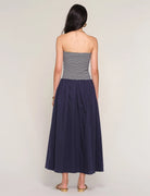 strapless midi dress with navy stripes on top and a drop waist bottom
