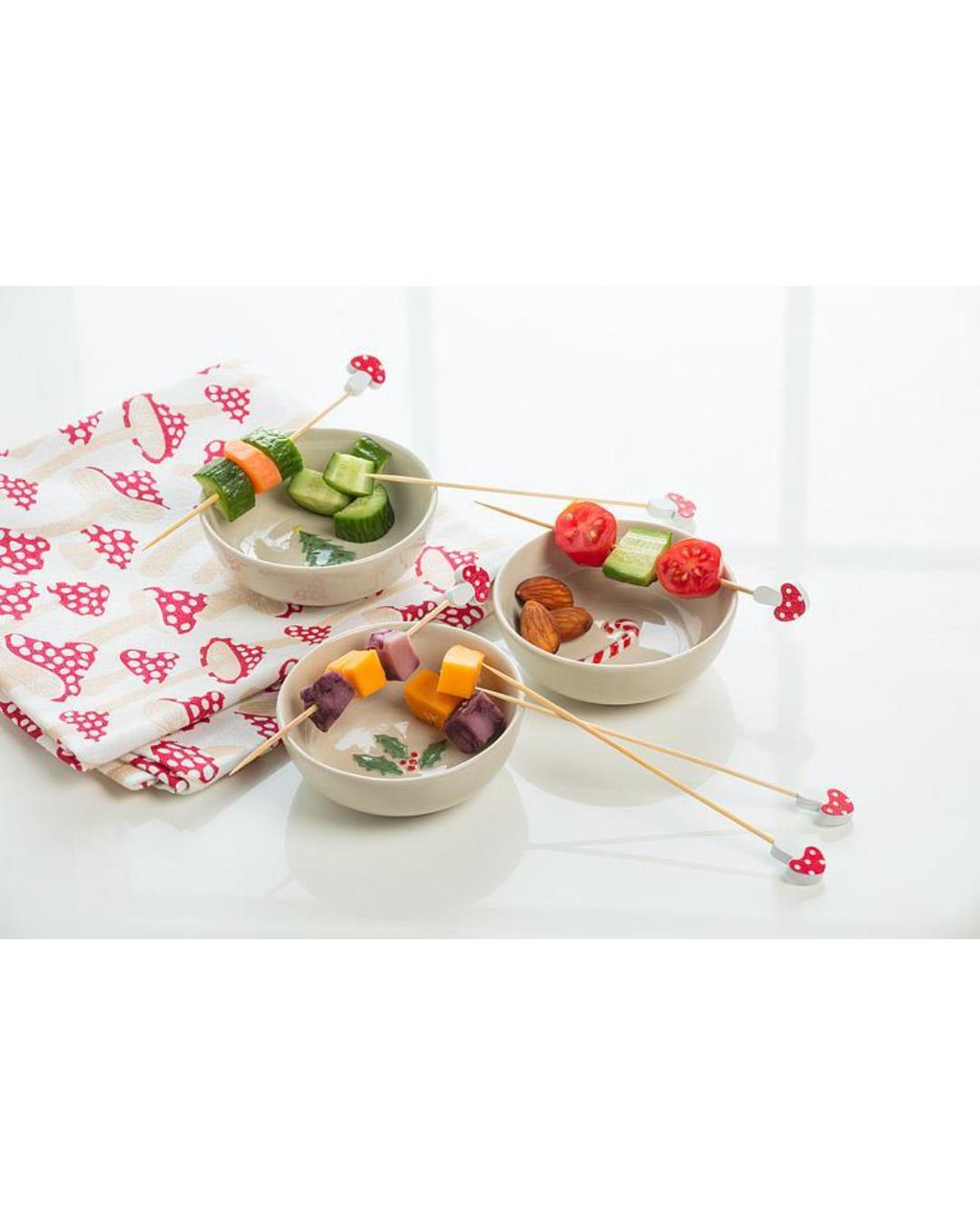 mini bowls with a candy cane in the bottom