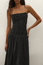 black maxi dress with cream polka dots