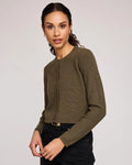 Woman wearing a green button down cropped cardigan
