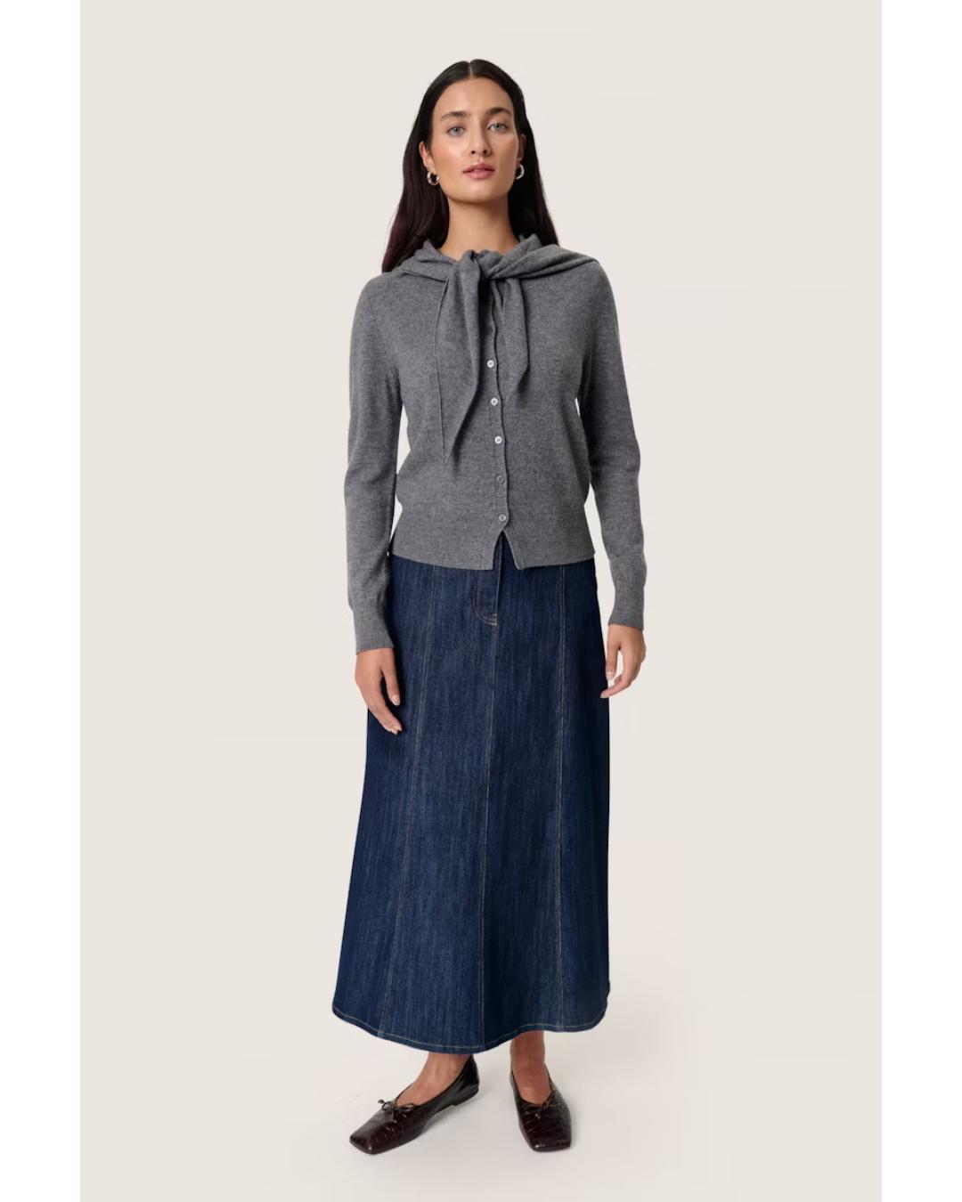 grey cardigan with a scarf attached over the shoulders 