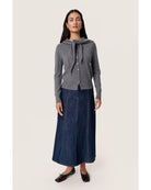 grey cardigan with a scarf attached over the shoulders 