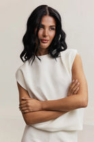 white tank top with padded shoulders