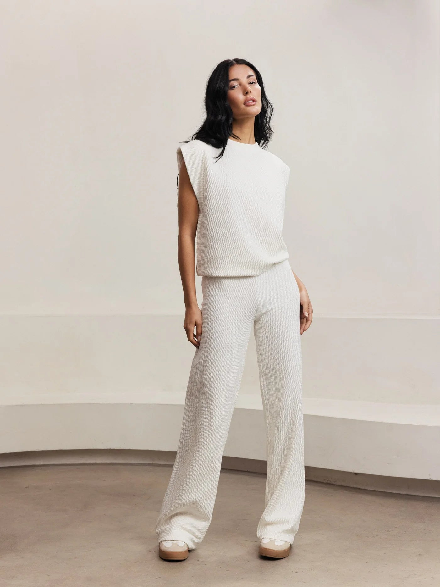 white tank top with padded shoulders