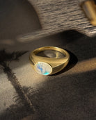 chunky gold ring with moonstone in the middle