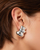 statement silver clip on earrings