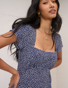 blue midi dress in blue with small white polka dots
