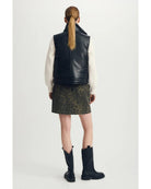 reversible vest with black on one side and beige sherpa on the other