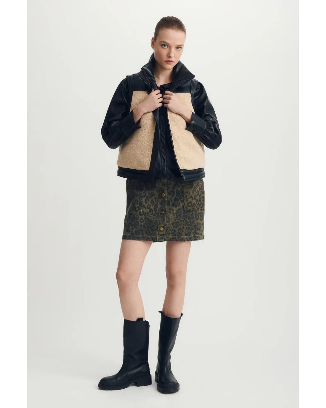 reversible vest with black on one side and beige sherpa on the other