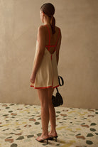 mini cream dress with orange outline