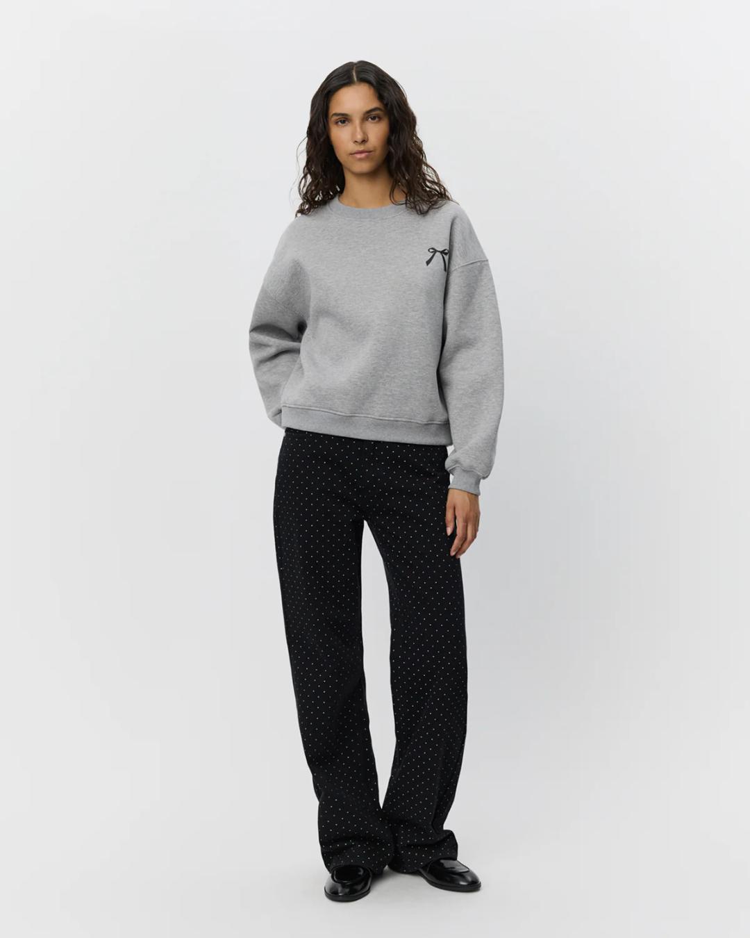 black relaxed jean with rhinestones all over