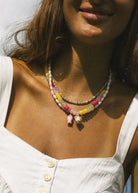 pastel beaded necklace with a heart pendant 