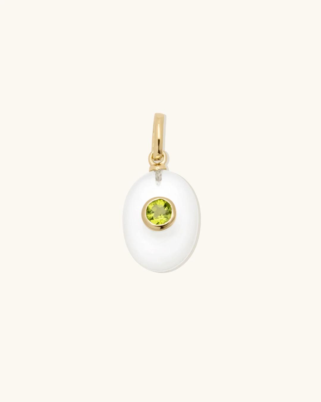 pearl charm with a birthstone in the middle