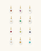 pearl charm with a birthstone in the middle
