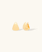 pair of gold pear shaped claw hoops