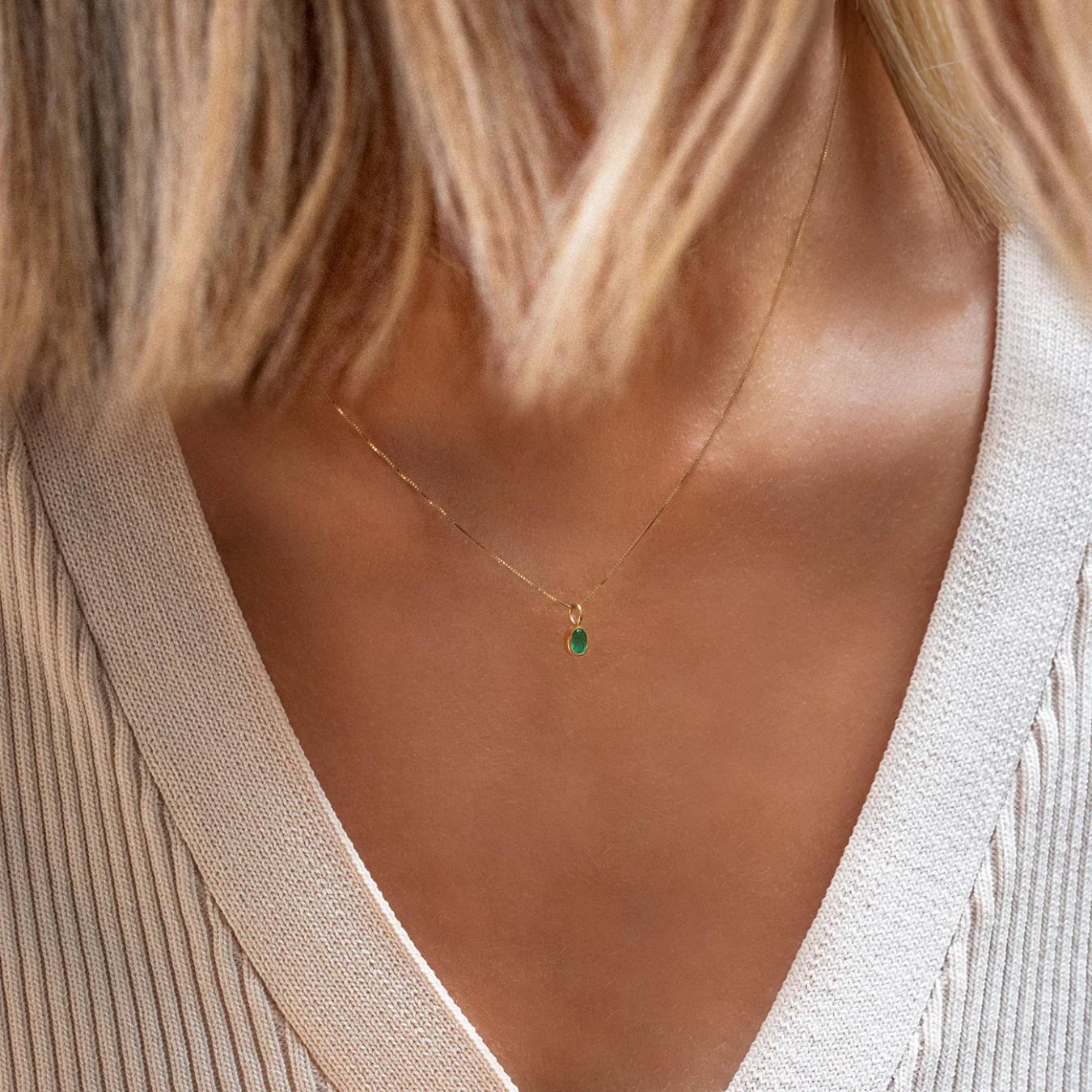 emerald necklace on a gold chain