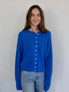 blue cardigan with buttons up the front