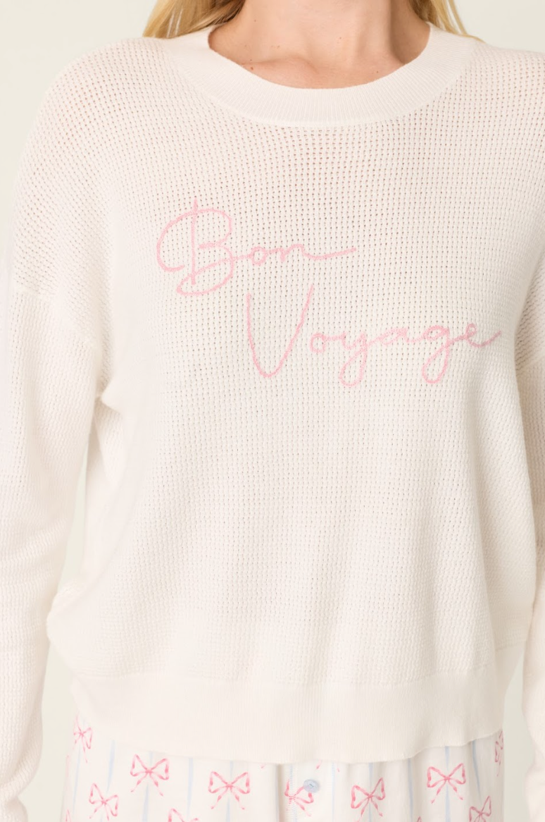 long sleeve sweater in white with bon voyage in text