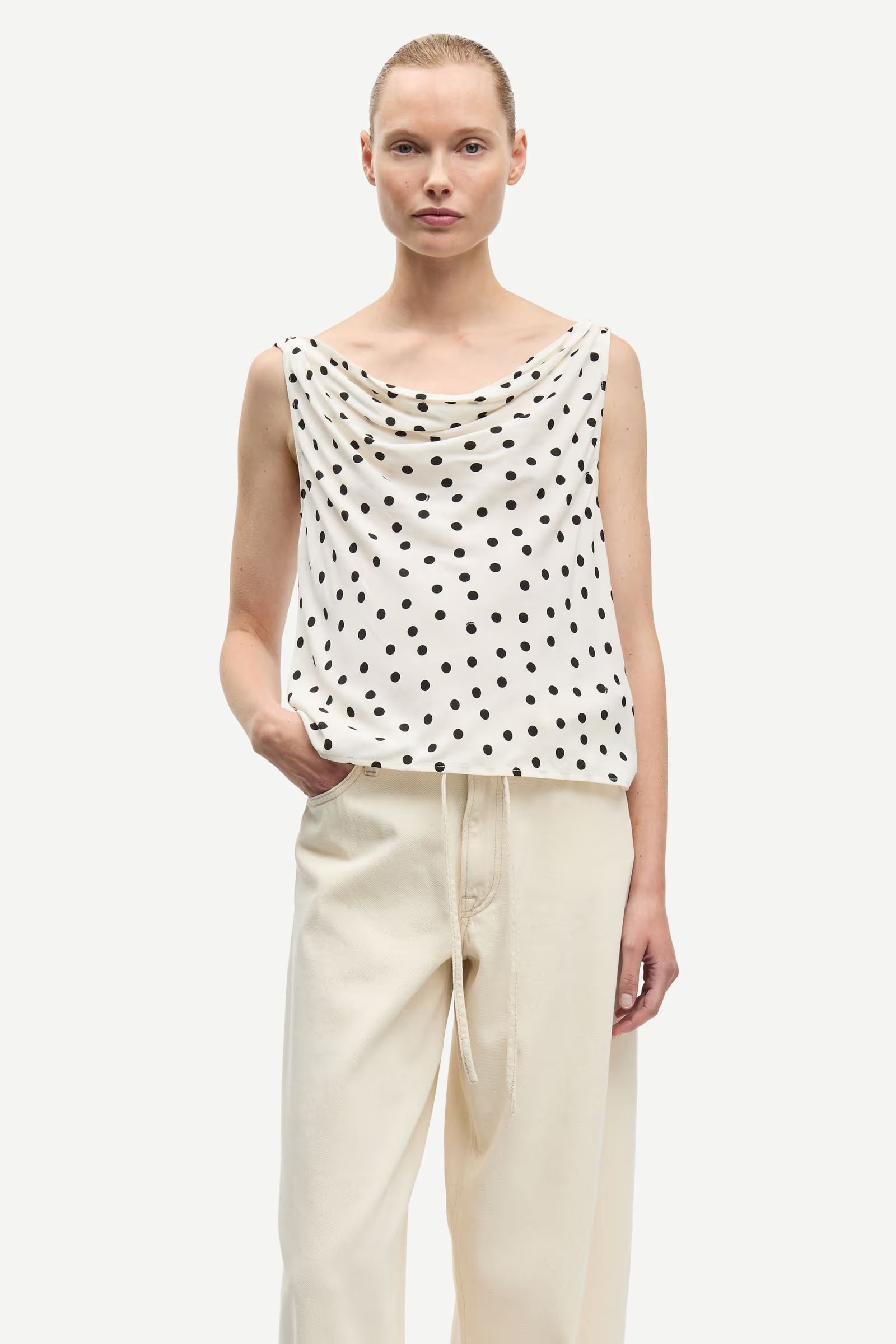 cream tank with black polka dots
