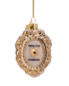gold ornament with text press for champagne