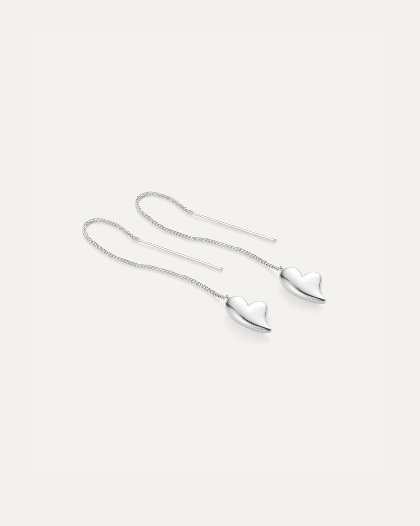 silver threader earrings with a heart on the bottom