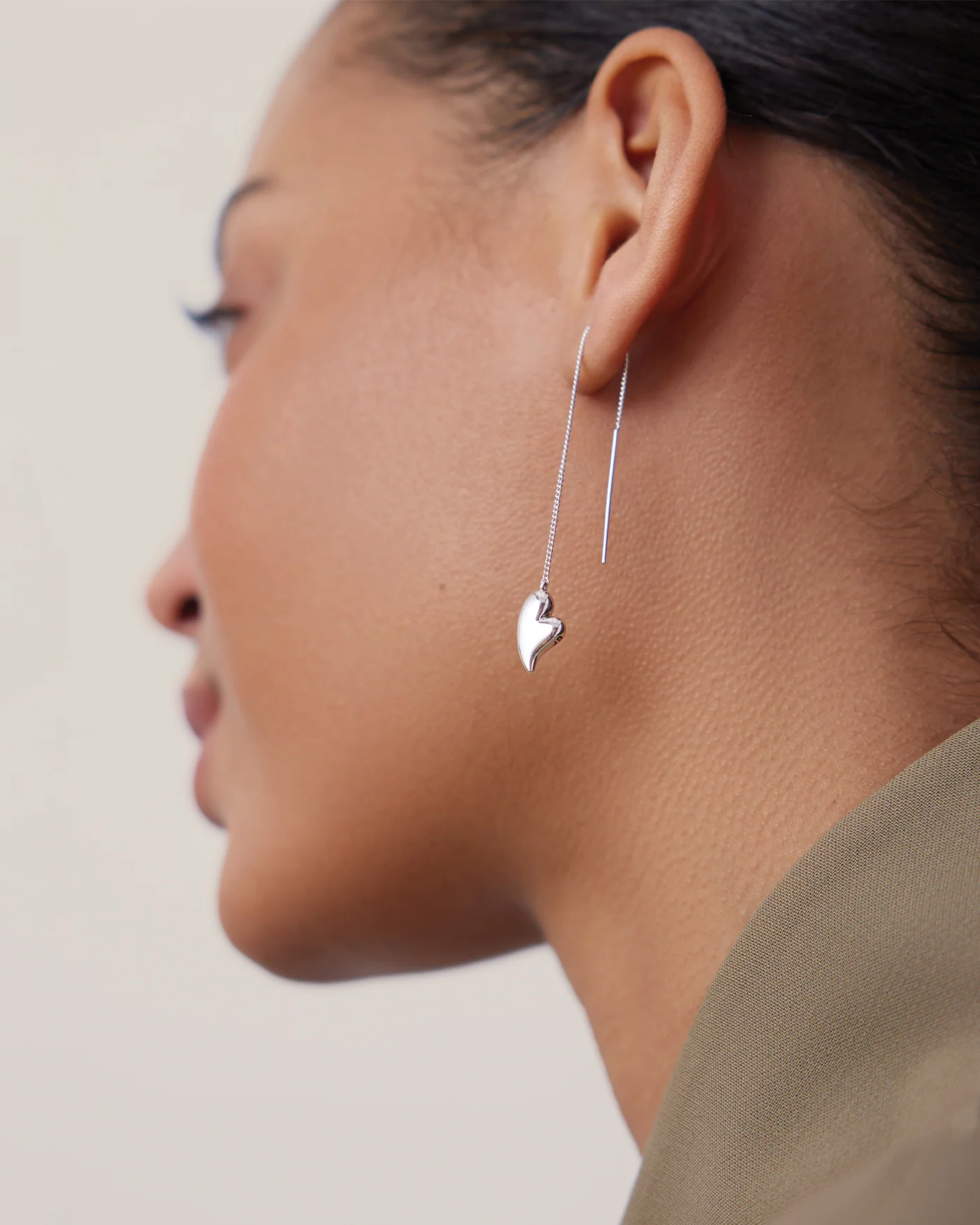 silver threader earrings with a heart on the bottom