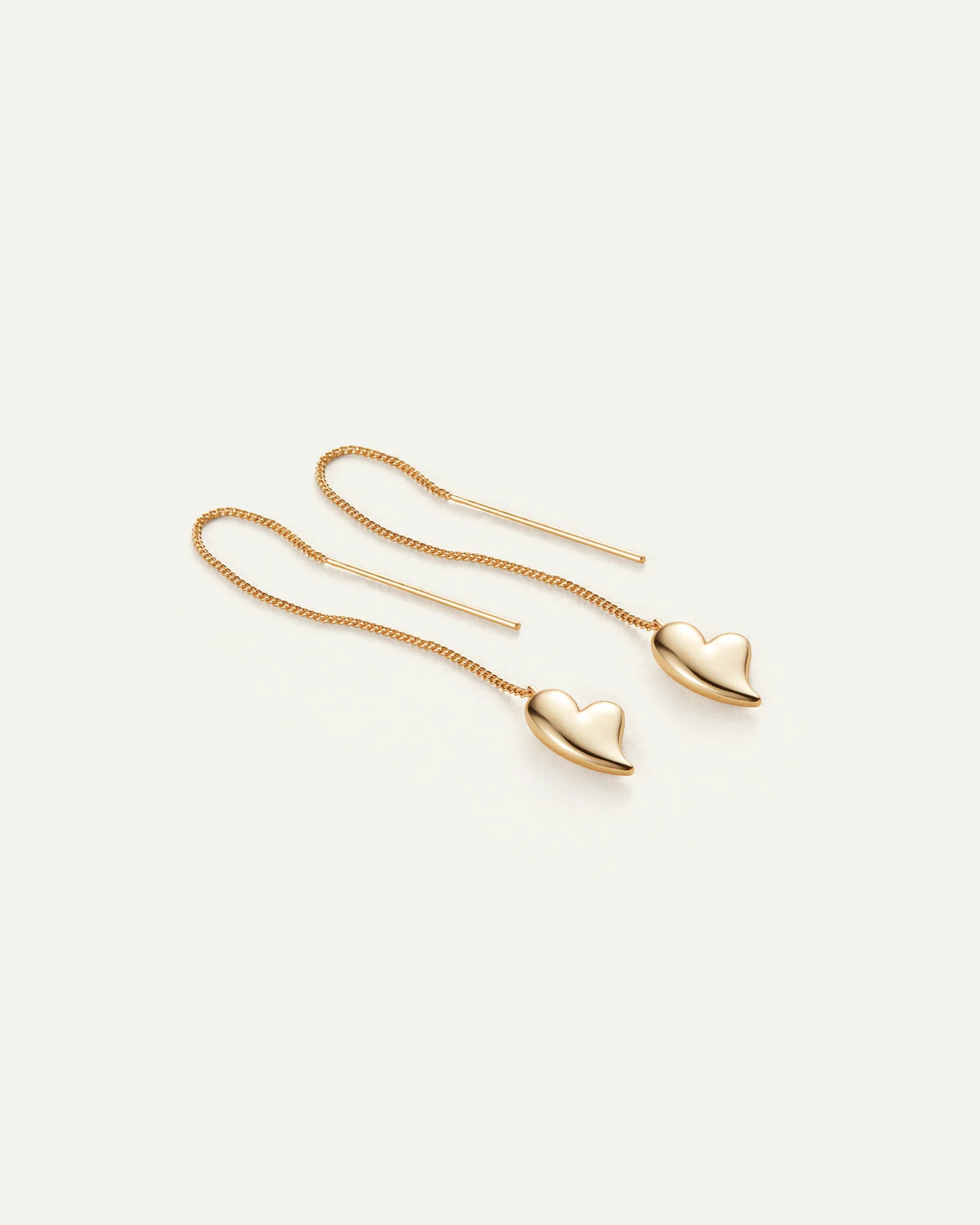 gold threader earrings with heart on bottom
